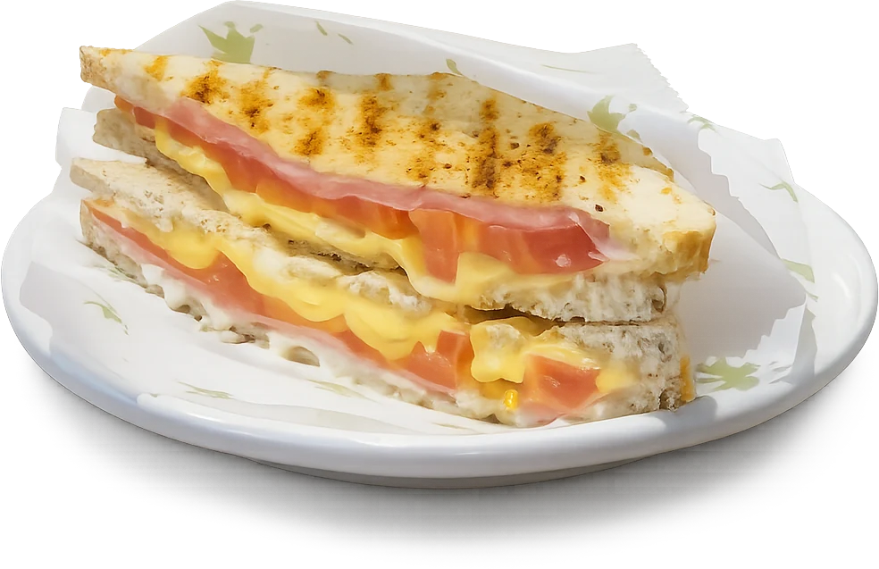 Toast Misto servido no prato, com presunto, queijo e tomate visíveis.